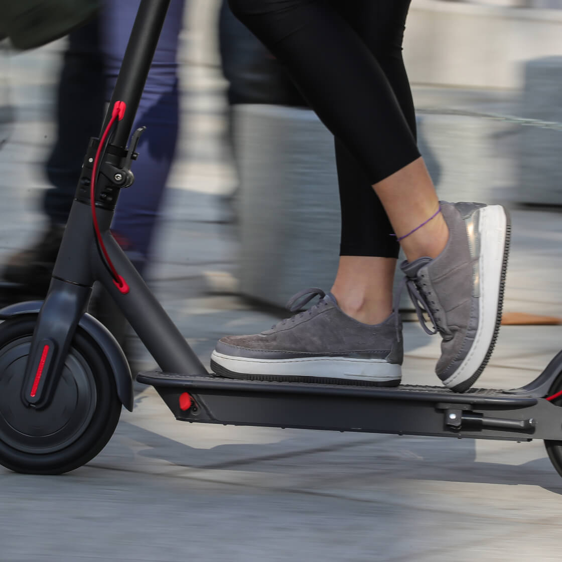 Person riding a Ducati scooter